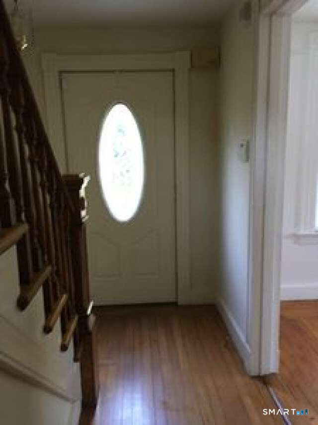 294 Church Street Guilford, CT 06437 - Photo 32 of 32 a view of a livingroom with wooden floor and a large window