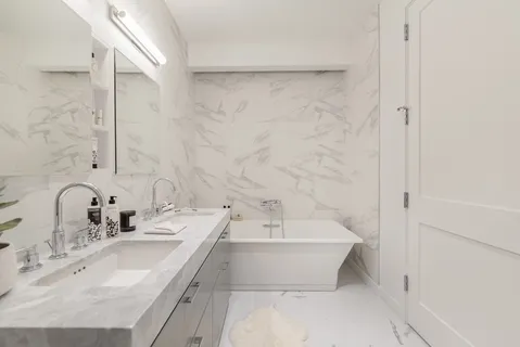 a view of a balcony with two chairs