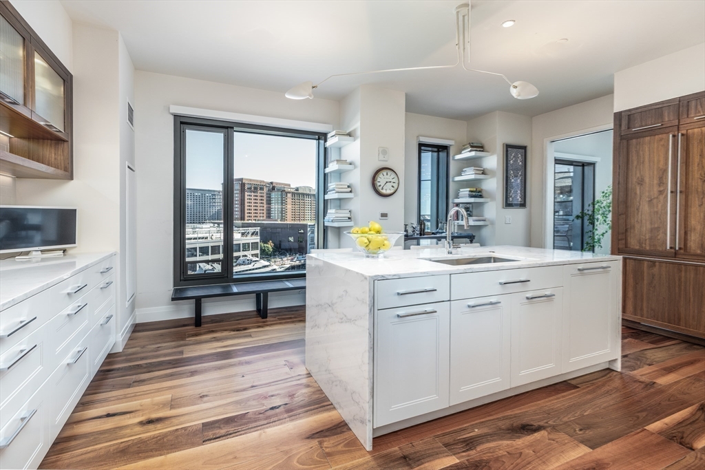 300 Pier 4 Blvd., Unit PHM Boston, MA 02210 - Photo 11 of 34 a spacious bathroom with double vanity and a mirror