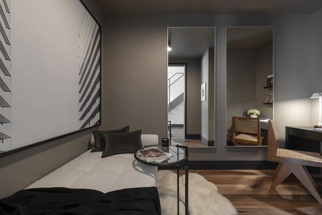 a dining room with furniture and window