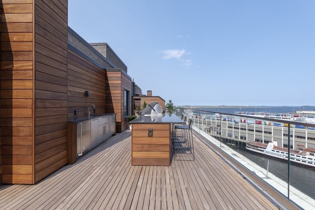 300 Pier 4 Blvd., Unit PHM Boston, MA 02210 - Photo 24 of 34 a view of roof deck with two couches and wooden floor