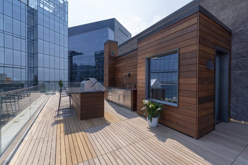 300 Pier 4 Blvd., Unit PHM Boston, MA 02210 - Photo 26 of 34 a view of a rooftop deck with couch and chairs