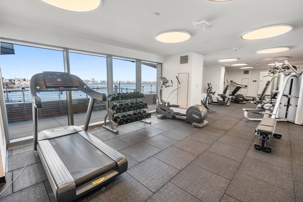 300 Pier 4 Blvd., Unit PHM Boston, MA 02210 - Photo 29 of 34 a room with gym equipment and a table