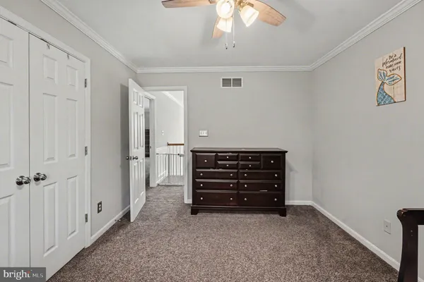 a room with pool table windows and a chandelier