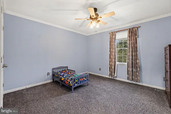 a living room with a flat screen tv and a couch