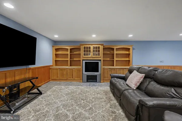 a view of a field of grass and trees