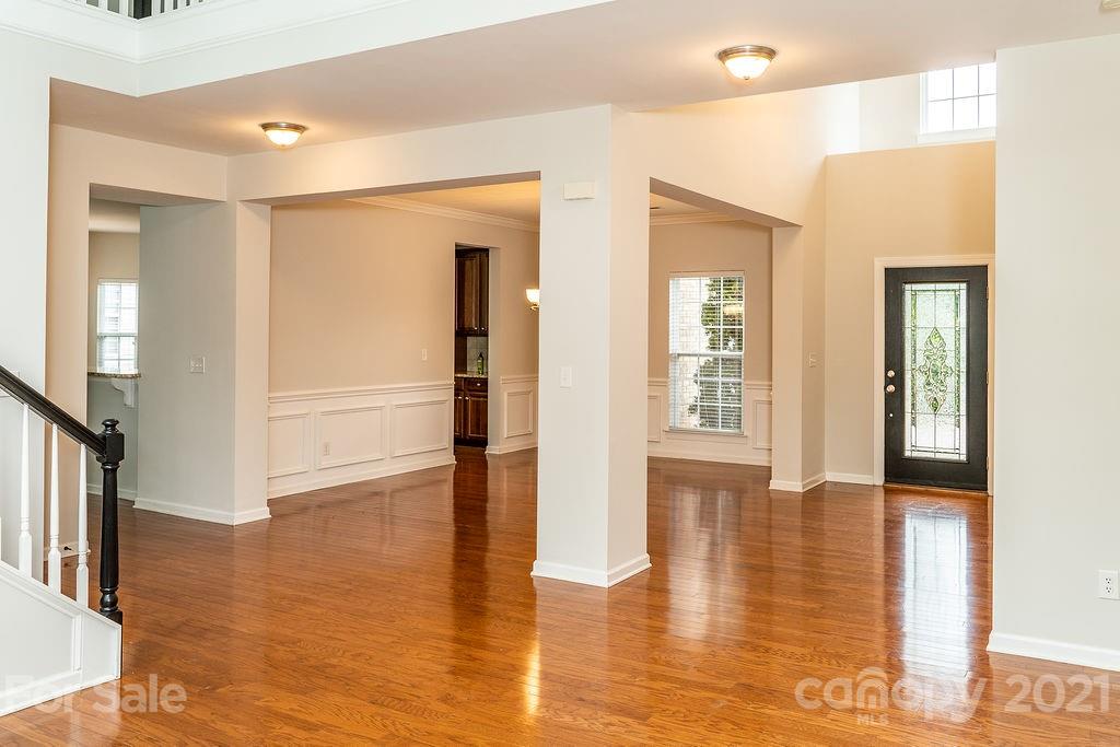 1032 Spanish Moss Road Indian Trail, NC 28079 - Photo 2 of 37 a view of an entryway of a house and wooden floor