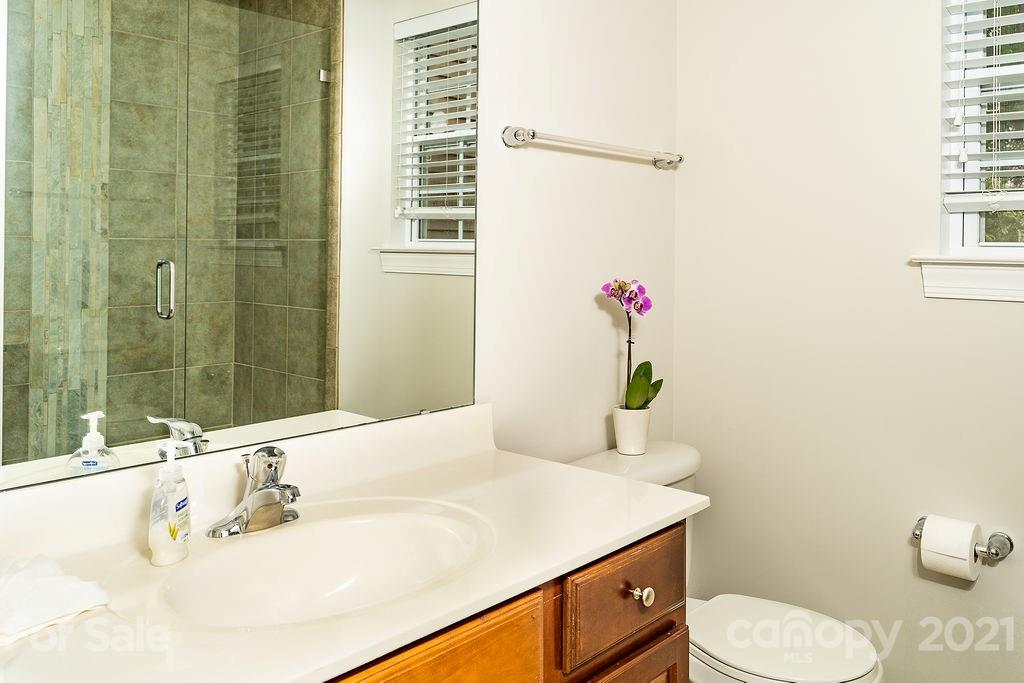 1032 Spanish Moss Road Indian Trail, NC 28079 - Photo 16 of 37 a bathroom with a sink toilet and shower