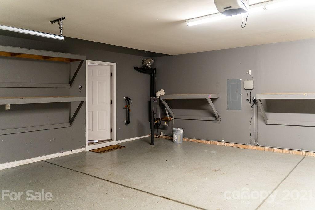 1032 Spanish Moss Road Indian Trail, NC 28079 - Photo 34 of 37 a room with gym equipment and view of living room