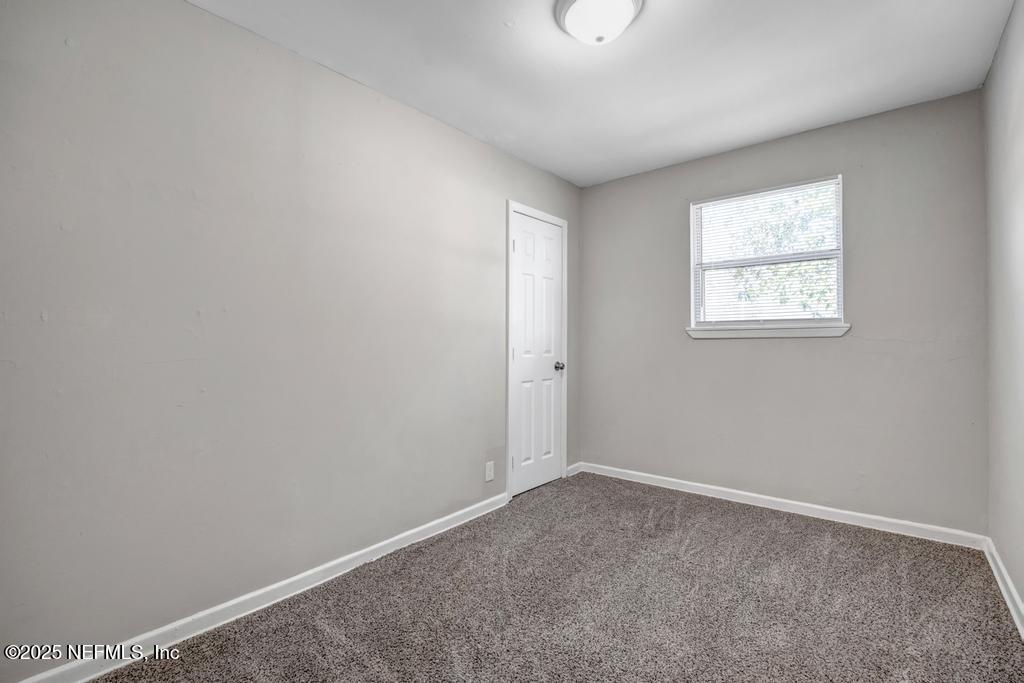 5352 Vick Avenue Jacksonville, FL 32254 - Photo 16 of 26 an empty room with a window