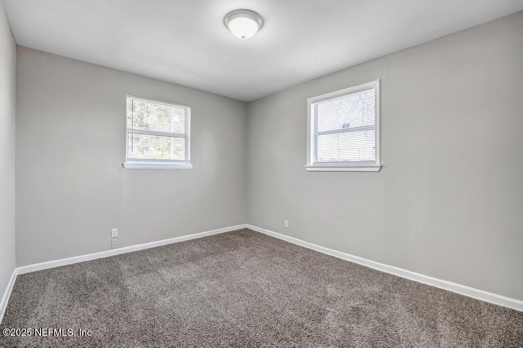 5352 Vick Avenue Jacksonville, FL 32254 - Photo 18 of 26 an empty room with a window