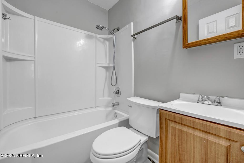 5352 Vick Avenue Jacksonville, FL 32254 - Photo 22 of 26 a bathroom with a sink toilet and shower