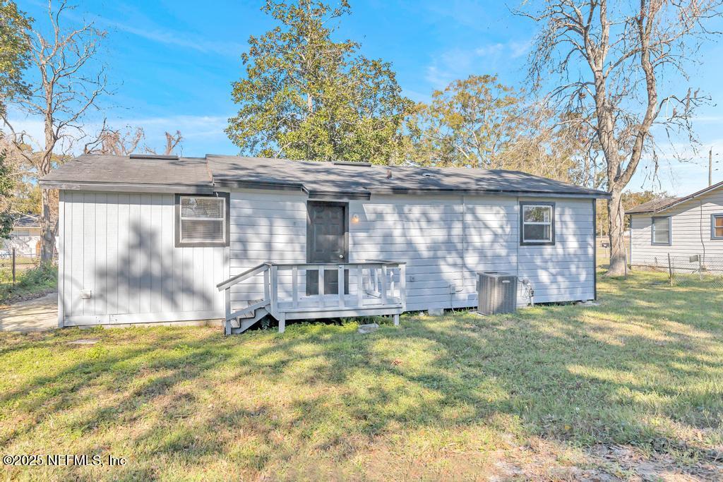 5352 Vick Avenue Jacksonville, FL 32254 - Photo 24 of 26 a view of a house with a yard and a tree