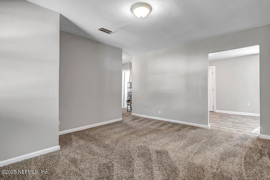 5352 Vick Avenue Jacksonville, FL 32254 - Photo 5 of 26 an empty room with an entryway