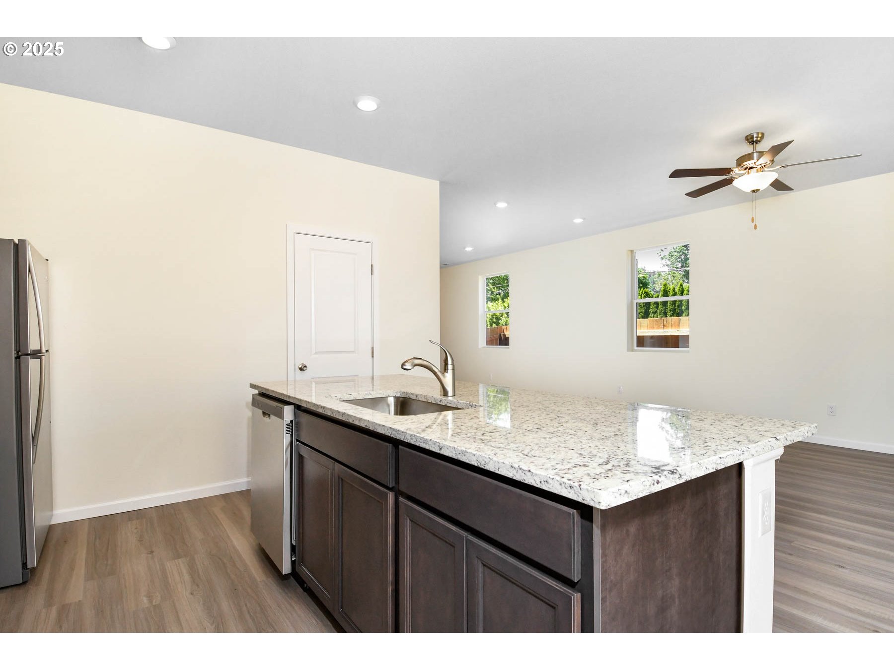 3989 Southwest Duniway Lane Gresham, OR 97080 - Photo 19 of 19 a bathroom with a granite countertop sink a toilet and a mirror
