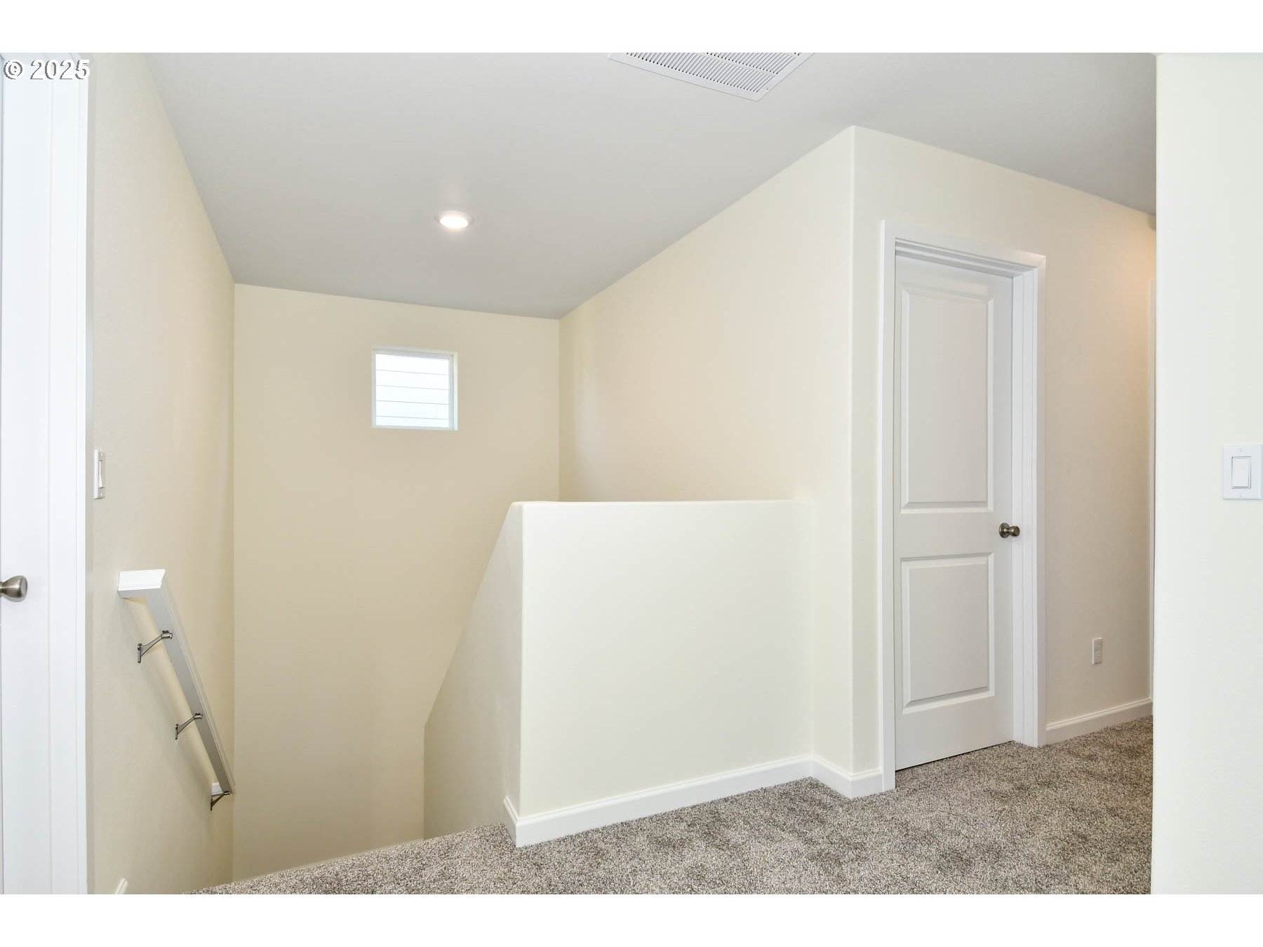3989 Southwest Duniway Lane Gresham, OR 97080 - Photo 3 of 19 a view of hallway with a white kitchen
