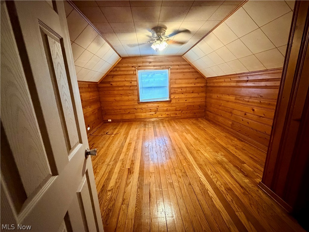 10506 Park Heights Road Cleveland, OH 44104 - Photo 18 of 22 Spacious room featuring wood-finish flooring and plank wood paneling