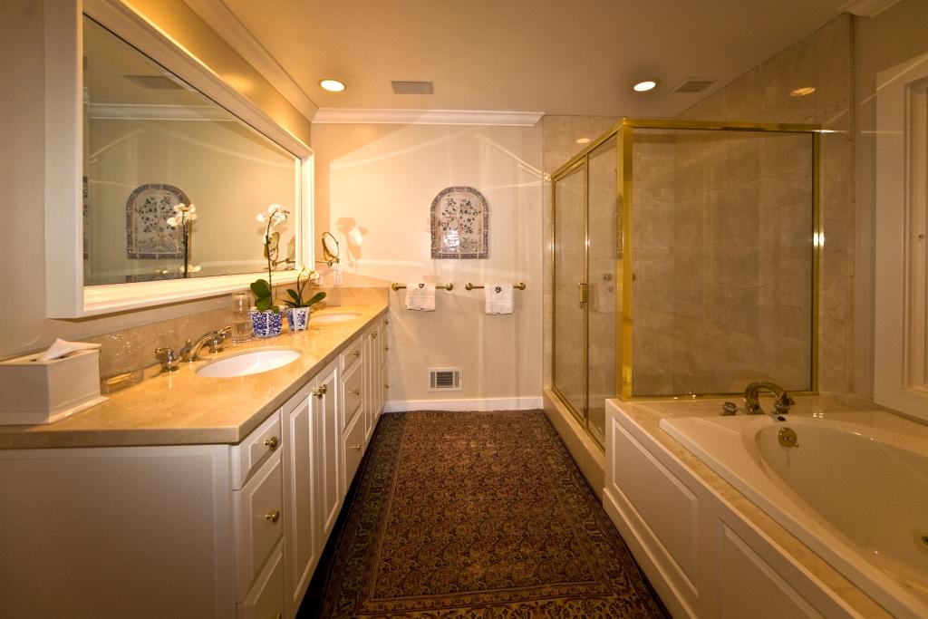 1415 Mission Ridge Road Santa Barbara, CA 93103 - Photo 3 of 12 a bathroom with a double vanity sink a mirror and a bathtub