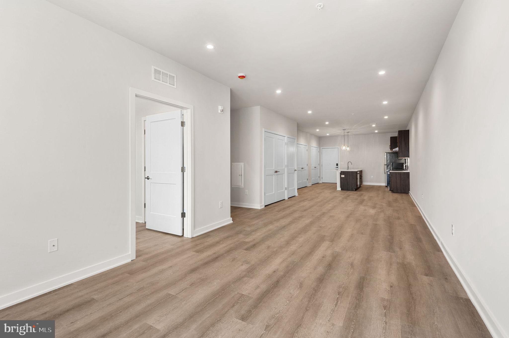 26 South York Road, Unit 305 Hatboro, PA 19040 - Photo 11 of 53 a view of empty room with wooden floor