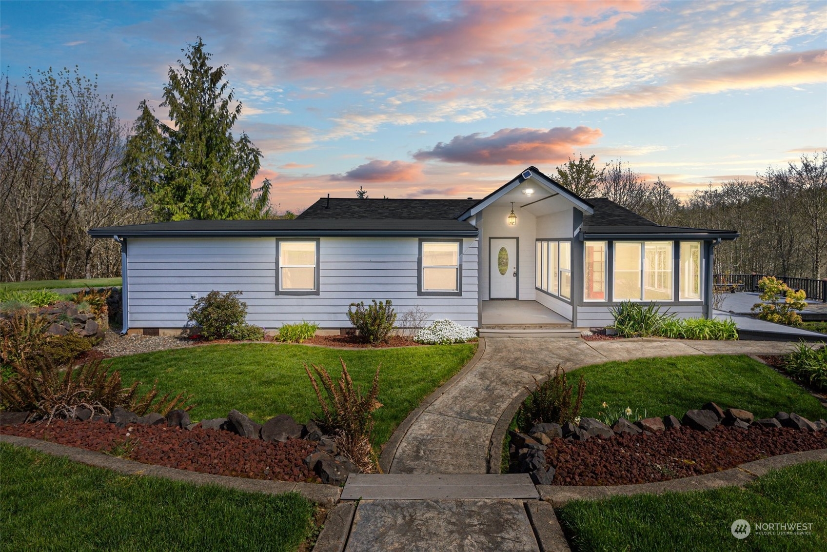 370 Manners Road Rochester, WA 98579 - Photo 1 of 34 a front view of a house with garden