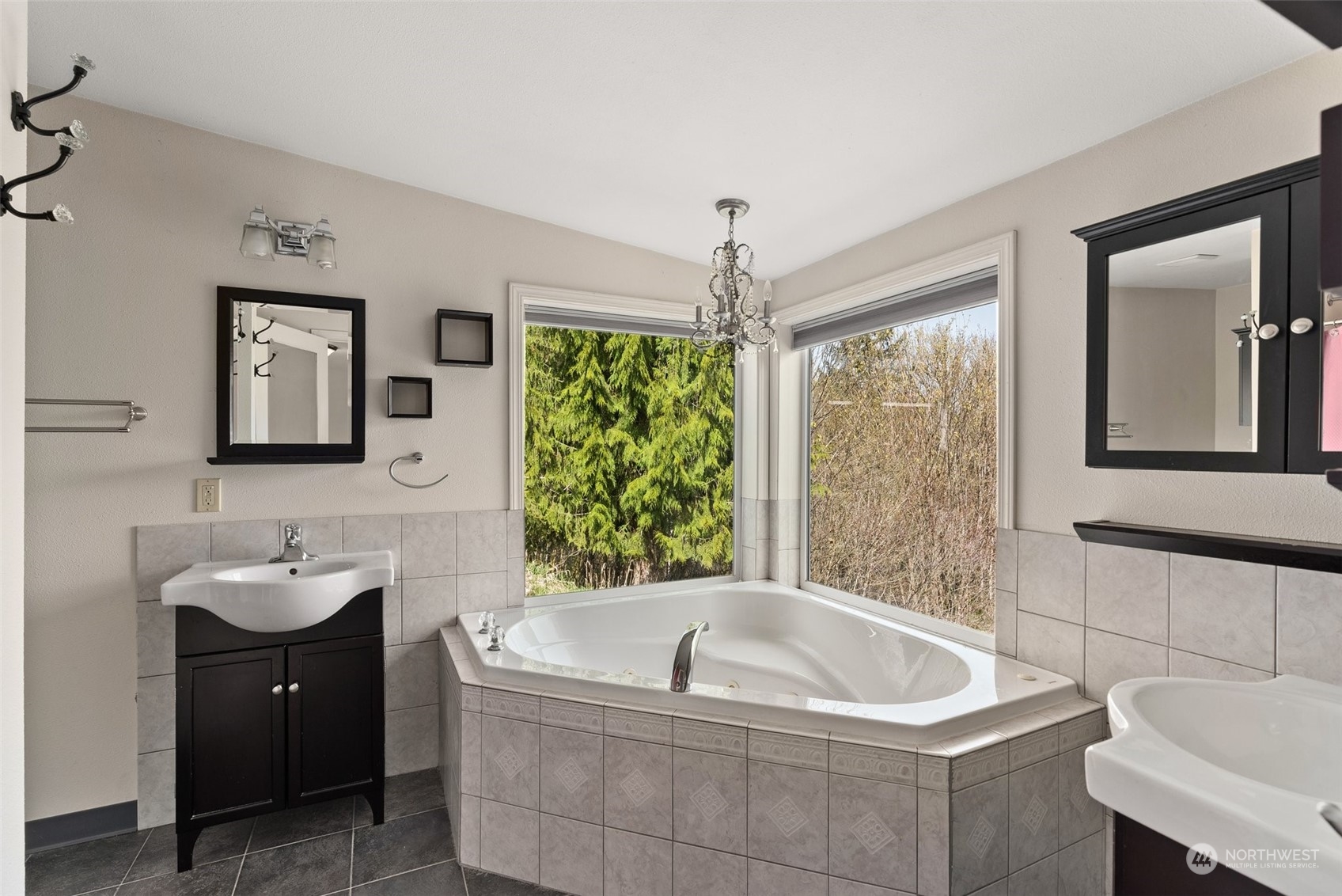 370 Manners Road Rochester, WA 98579 - Photo 17 of 34 a bathroom with a tub a sink and a window