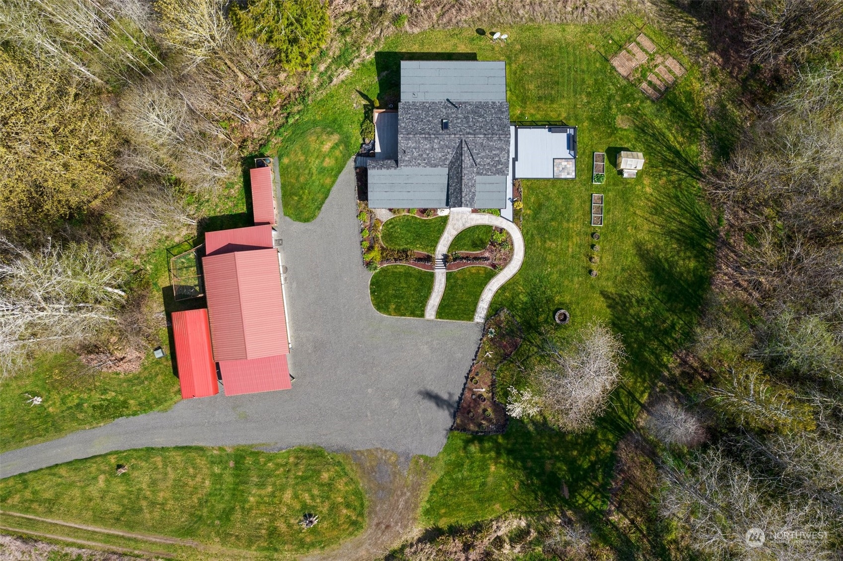 370 Manners Road Rochester, WA 98579 - Photo 4 of 34 an aerial view of a house with a yard and basket ball court