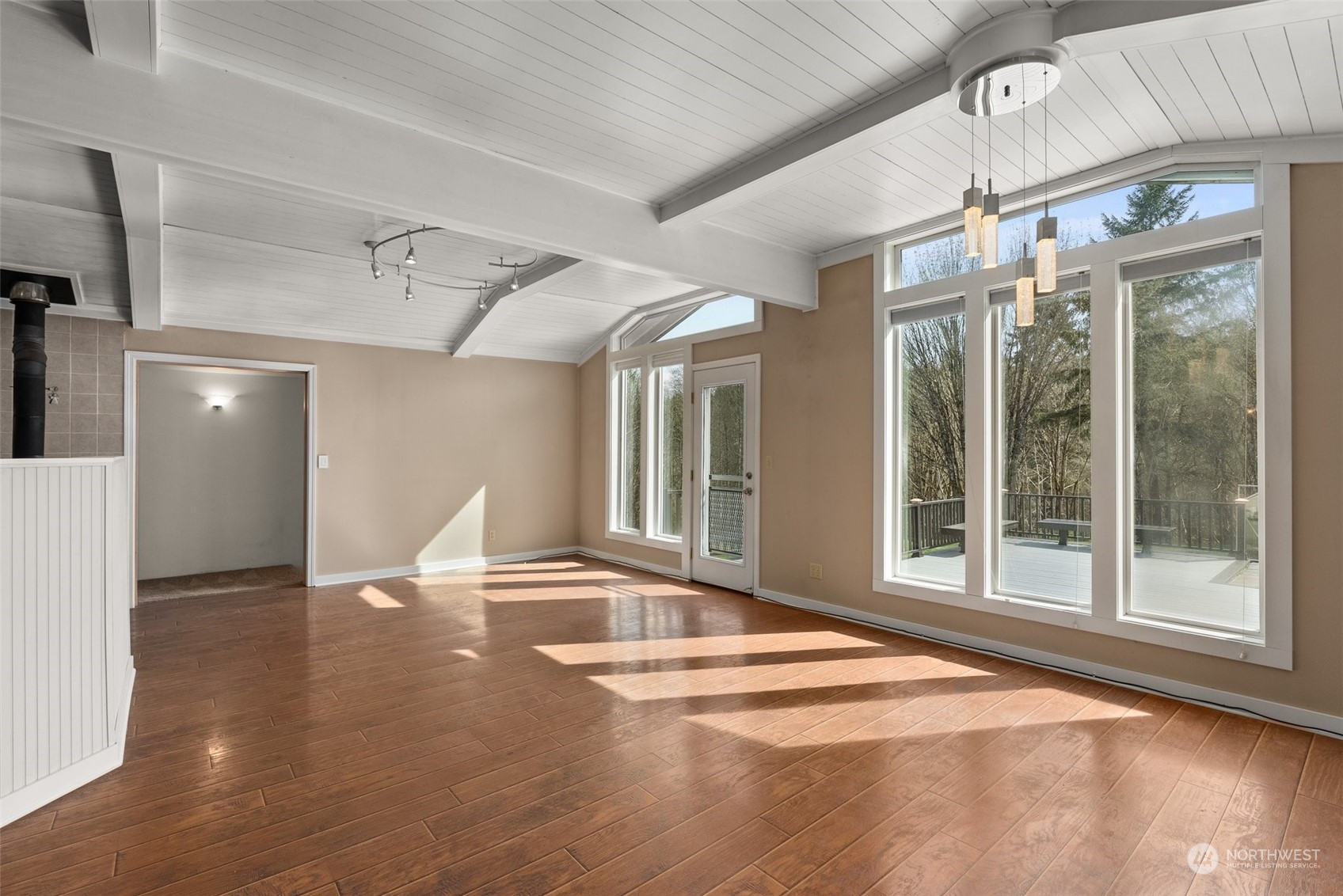 370 Manners Road Rochester, WA 98579 - Photo 9 of 34 a view of an empty room with wooden floor and a window