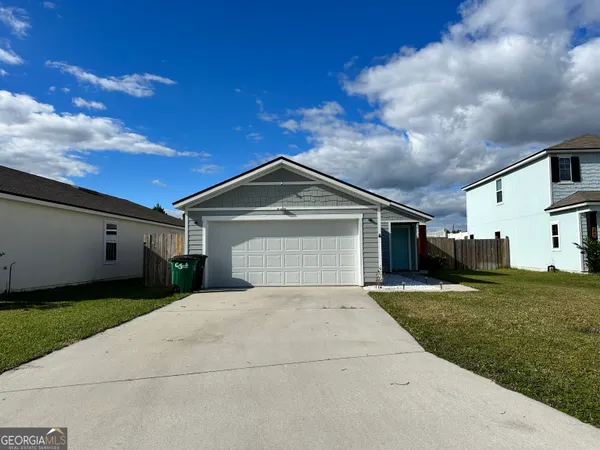 a front view of a house with yard