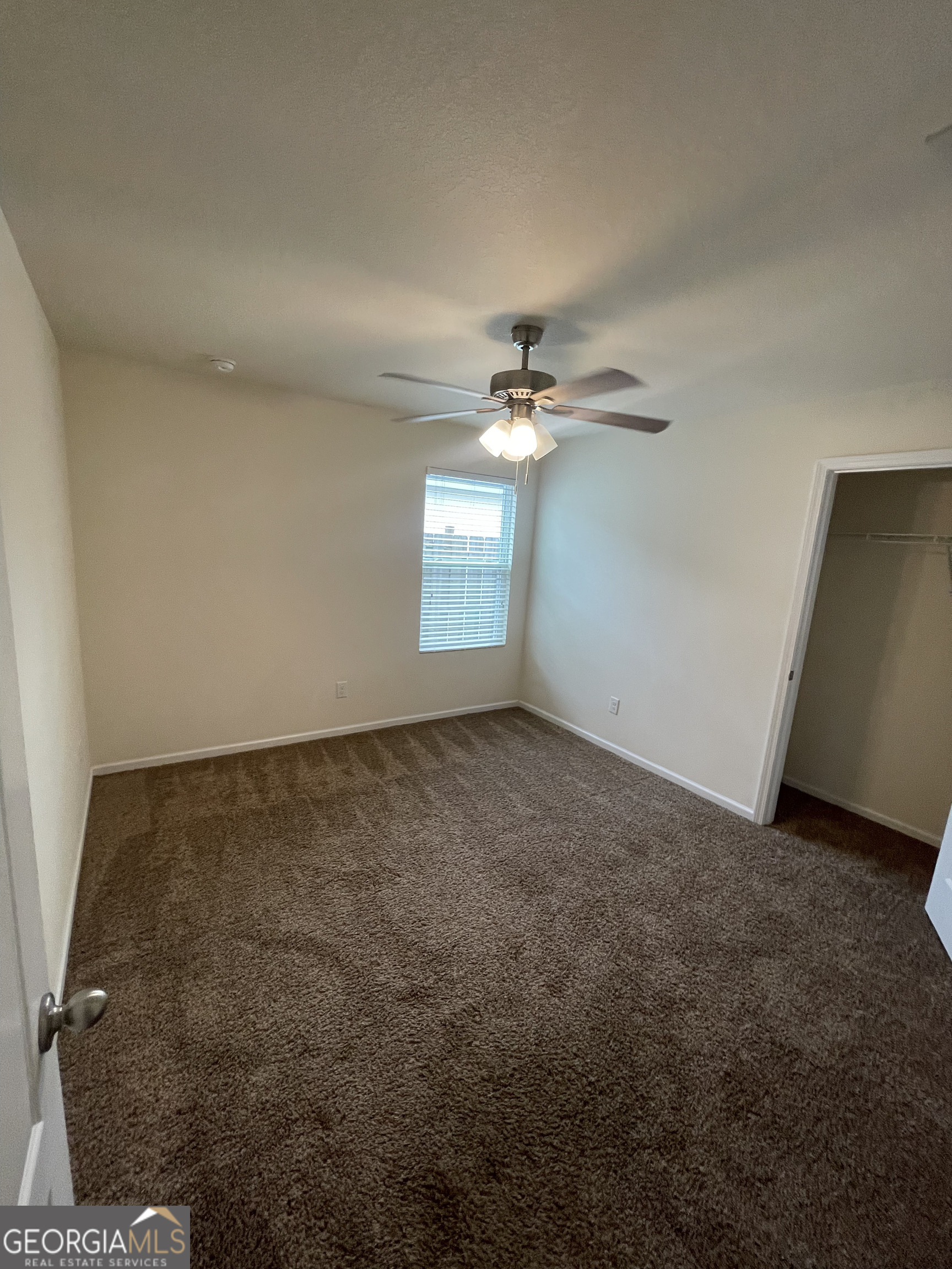 25 Fox Path St. Marys, GA 31558 - Photo 15 of 22 a view of an empty room with a chandelier fan