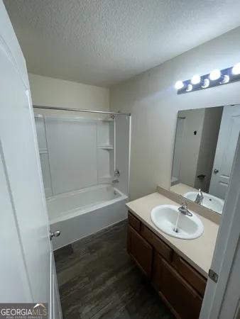a bathroom with a sink double vanity and a mirror