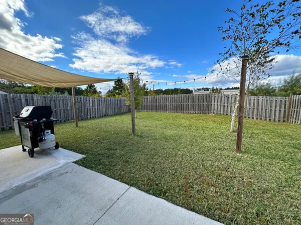 a view of a backyard with swings