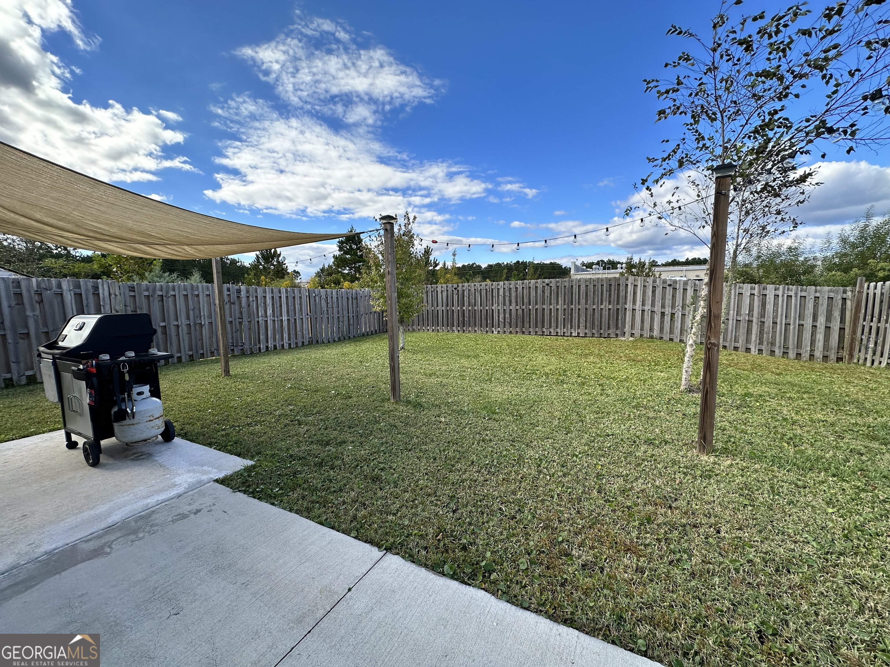 25 Fox Path St. Marys, GA 31558 - Photo 21 of 22 a view of a backyard with swings
