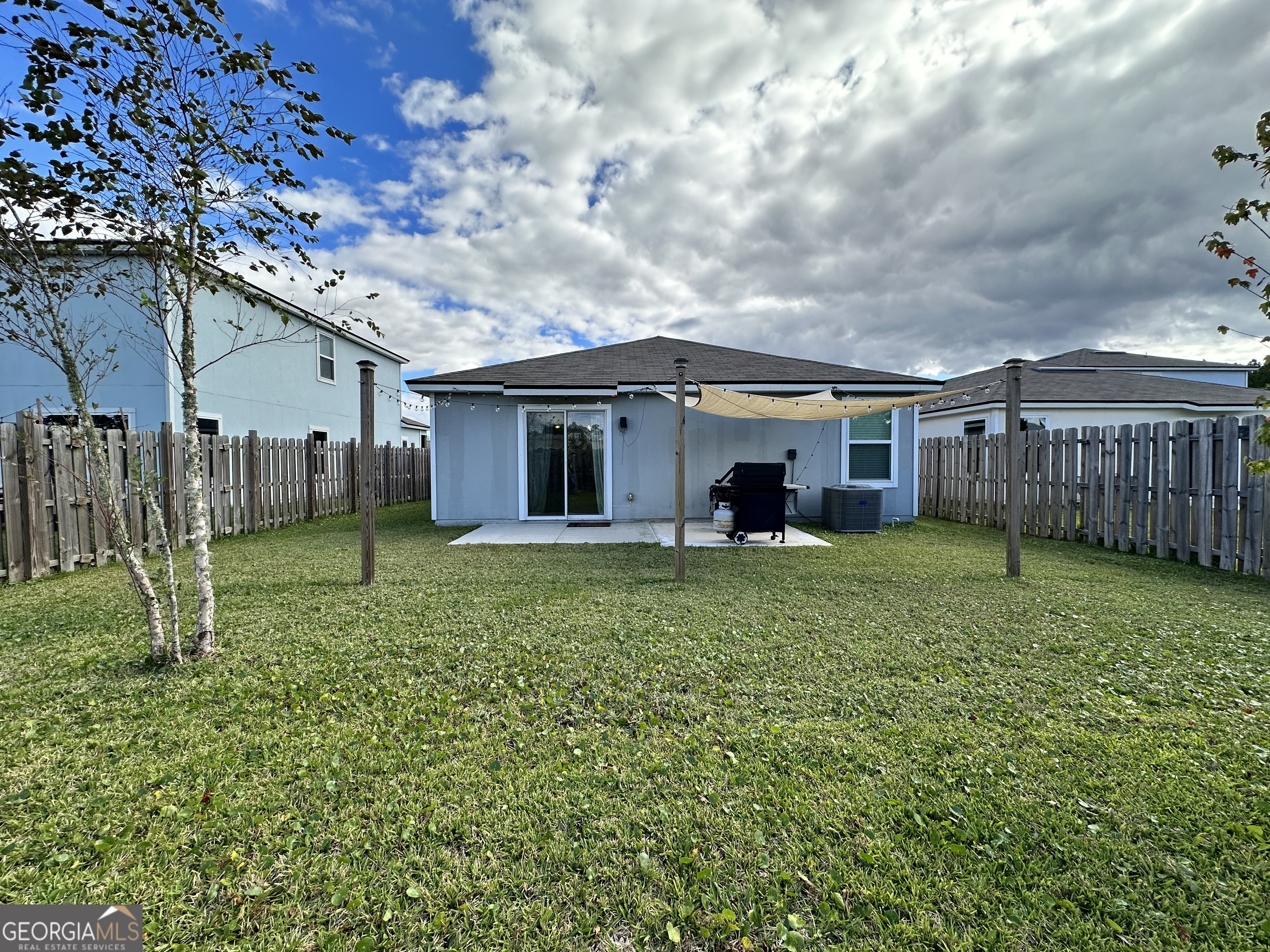 25 Fox Path St. Marys, GA 31558 - Photo 22 of 22 a view of a house with a backyard