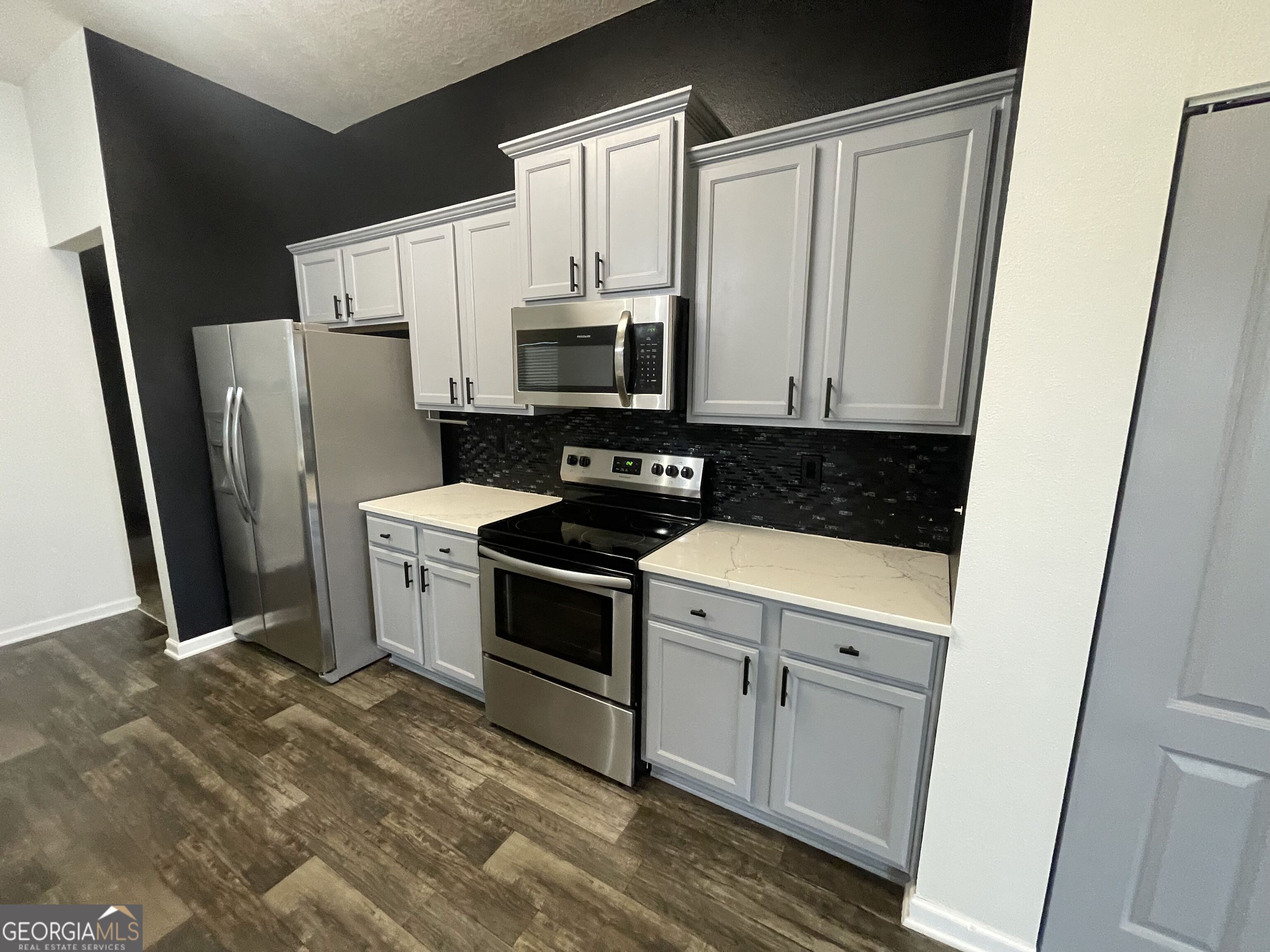 25 Fox Path St. Marys, GA 31558 - Photo 6 of 22 a kitchen with stainless steel appliances a refrigerator sink and microwave