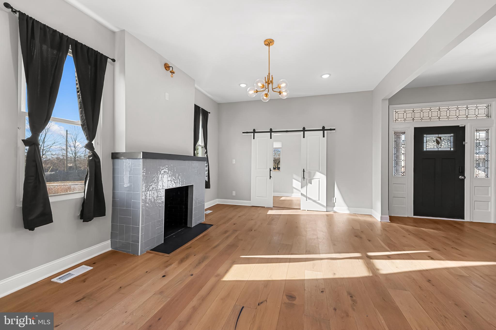 5503 Stuart Avenue Baltimore, MD 21215 - Photo 8 of 51 living room & sunroom