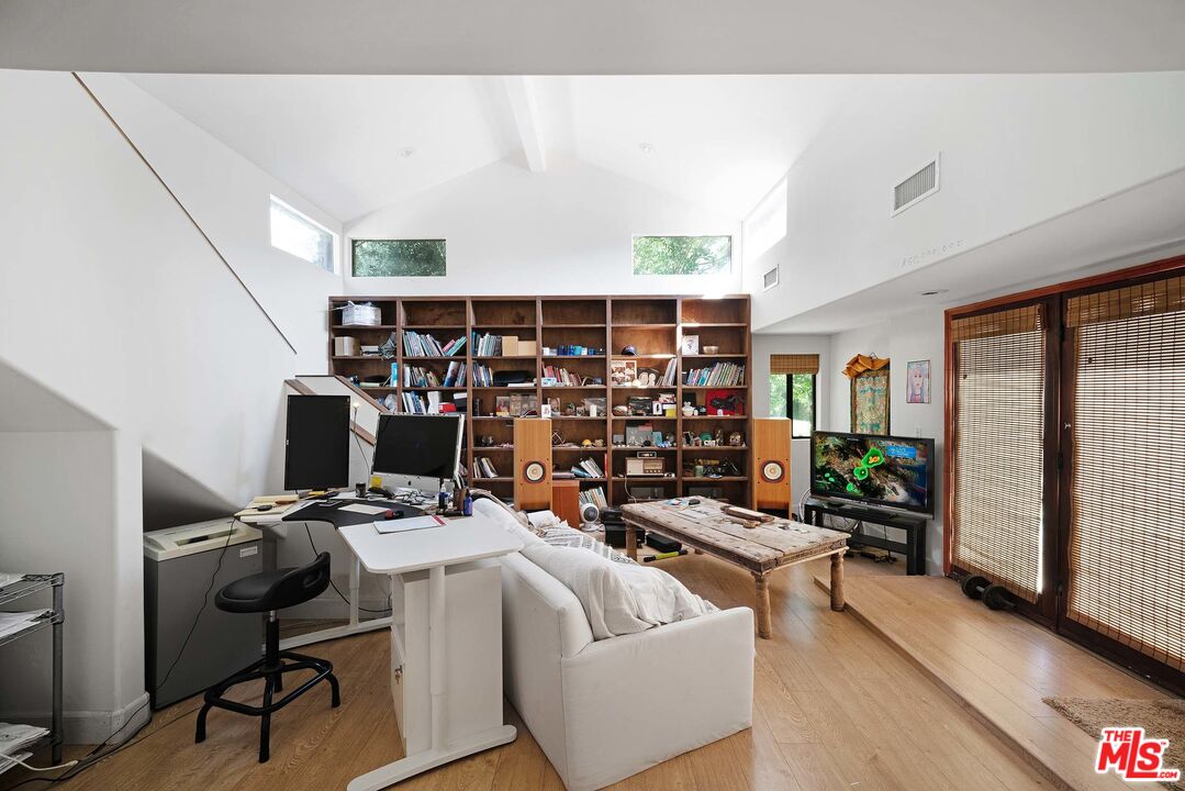 2251 Cold Canyon Road Calabasas, CA 91302 - Photo 28 of 47 a room with furniture and a potted plant