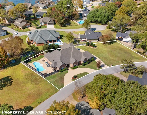 an aerial view of a house with a swimming pool