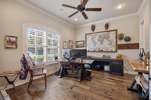 a work room with furniture and wooden floor