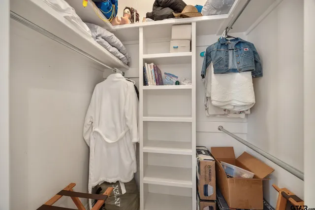 a room with shelves and a wooden floor