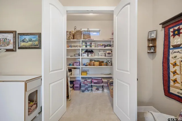 a room with furniture a rug and a window