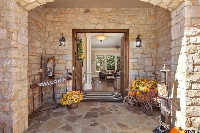 a building outdoor space with patio furniture and potted plants
