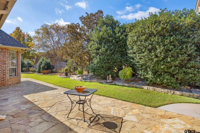a view of a swimming pool and lounge chairs