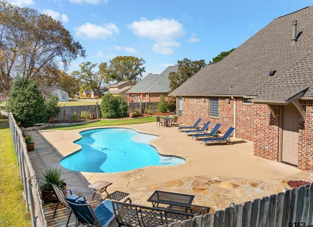 a view of a patio with swimming pool