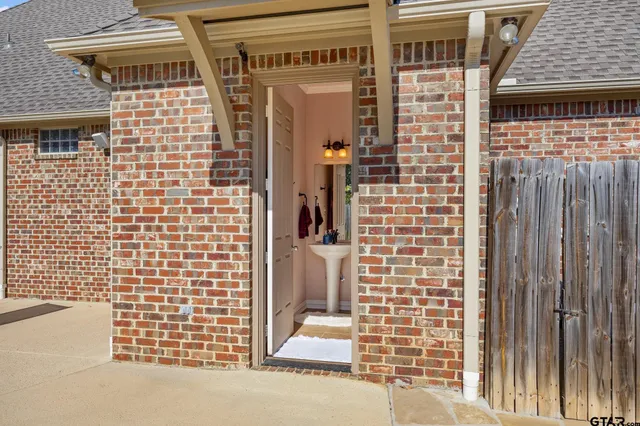 a view of a brick house with an outdoor space