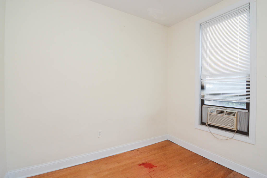 2347 West 24th Place, Unit 3R Chicago, IL 60608 - Photo 12 of 20 a view of a room with wooden floor and kitchen view