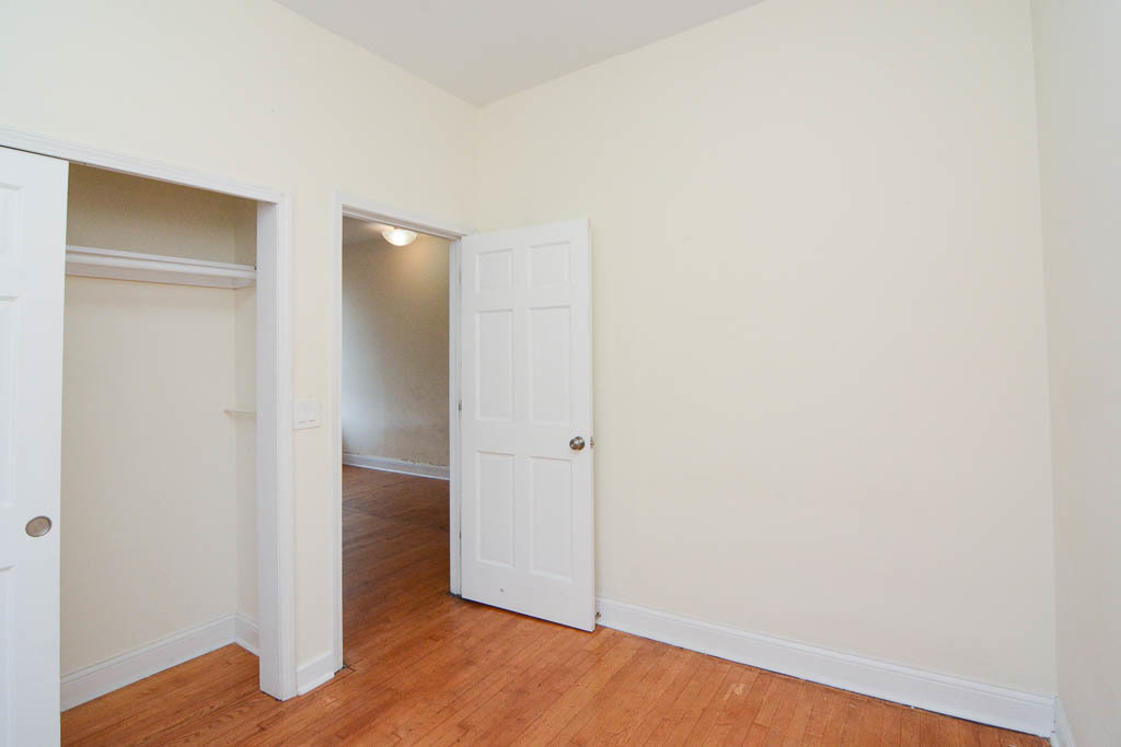 2347 West 24th Place, Unit 3R Chicago, IL 60608 - Photo 14 of 20 a view of an empty room with wooden floor