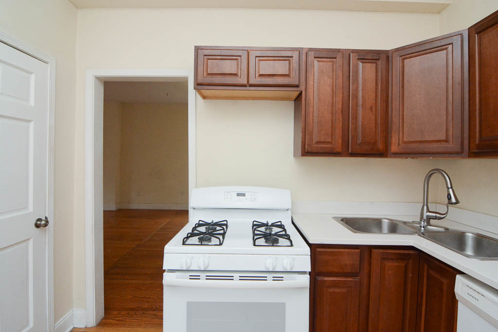 2347 West 24th Place, Unit 3R Chicago, IL 60608 - Photo 4 of 20 a kitchen with a stove and a sink
