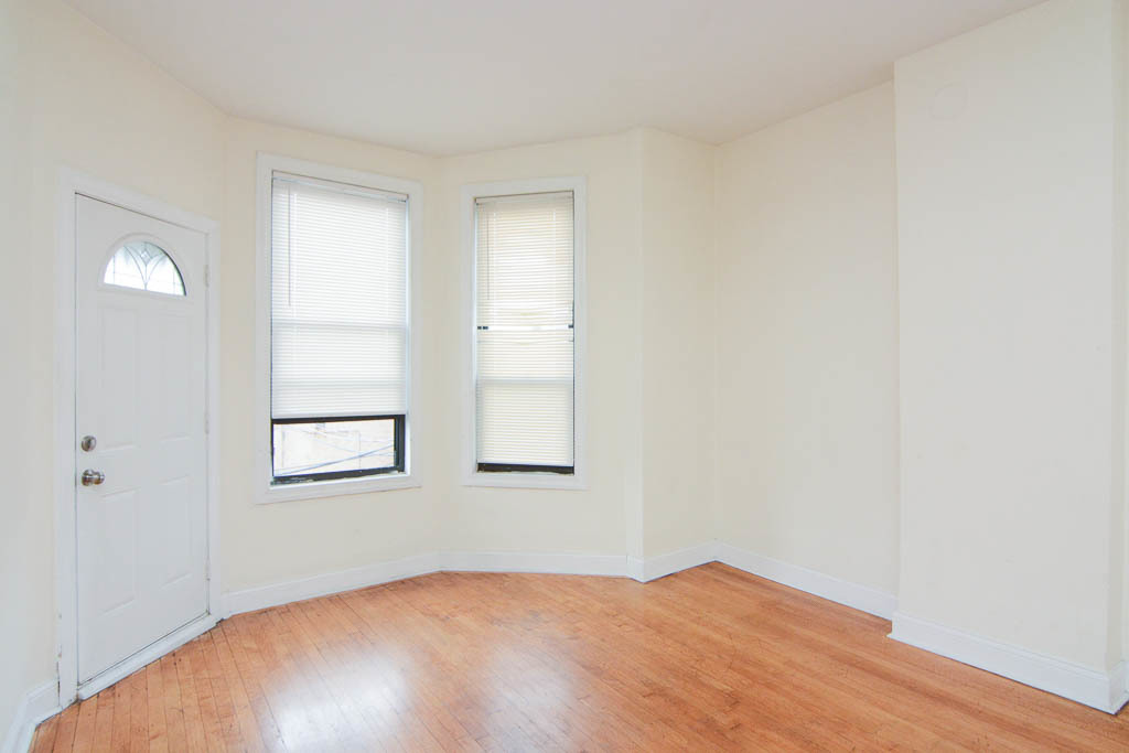 2347 West 24th Place, Unit 3R Chicago, IL 60608 - Photo 7 of 20 an empty room with windows