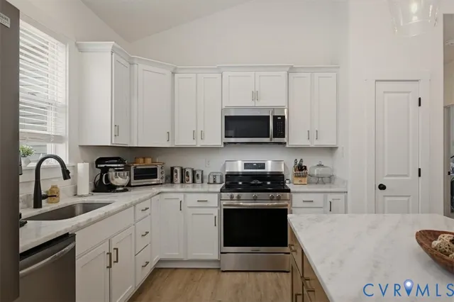 a bathroom with a sink vanity and a mirror