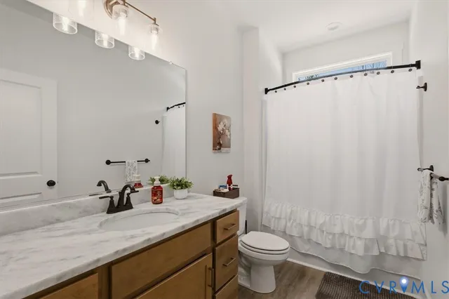 a bedroom with a bed and a television